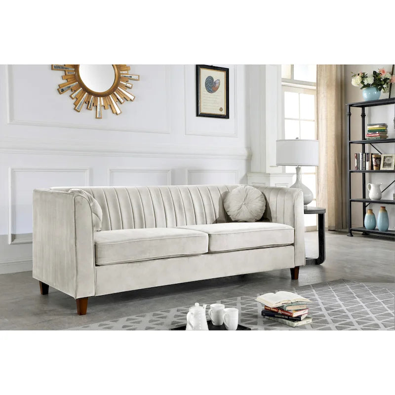 Canapé Chesterfield en velours avec dossier capitonné et coussins cylindriques