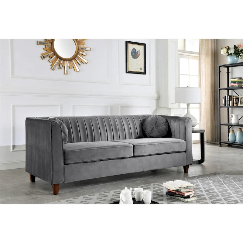 Canapé Chesterfield en velours avec dossier capitonné et coussins cylindriques