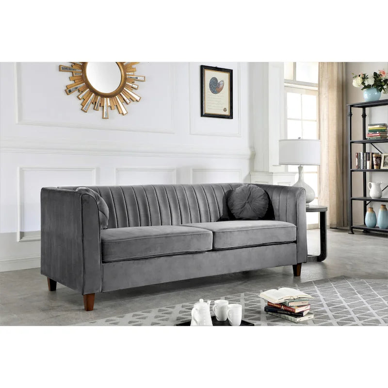 Canapé Chesterfield en velours avec dossier capitonné et coussins cylindriques